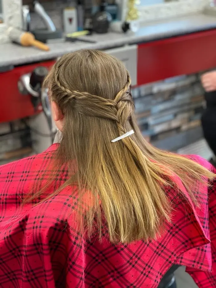 Braided half-up hairstyle by the hairdresser side